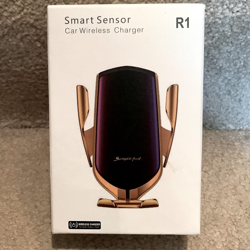 BRAND NEW in box SMART SENSOR Car Wireless Charger. Includes accessories.